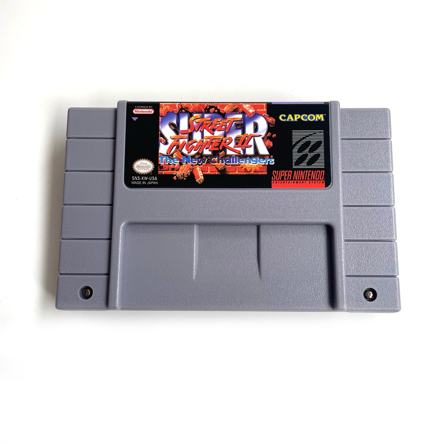 Super Street Fighter II The New Challengers cartridge with tray box manual for SNES super nintendo entertainment system